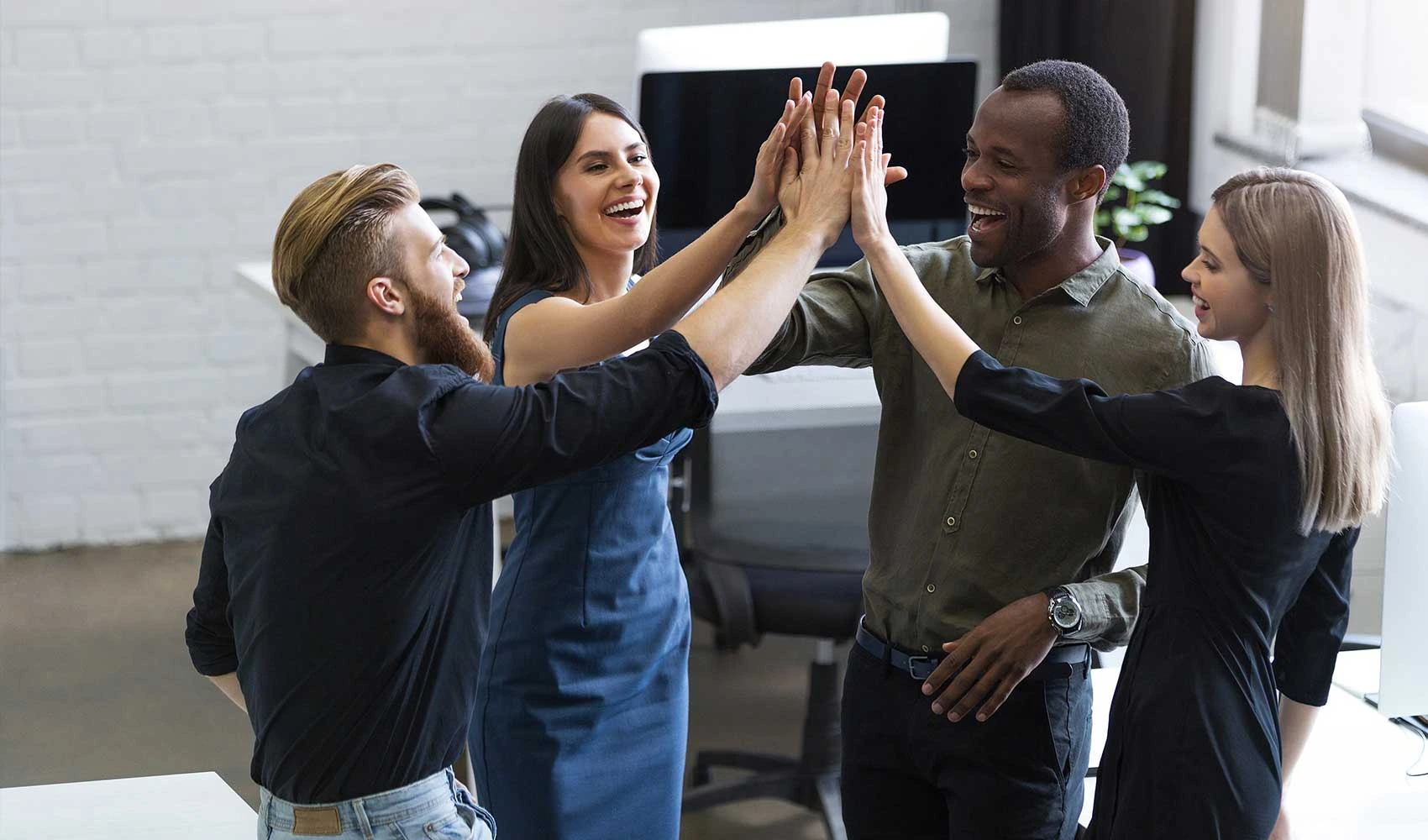 Happy employees having high five