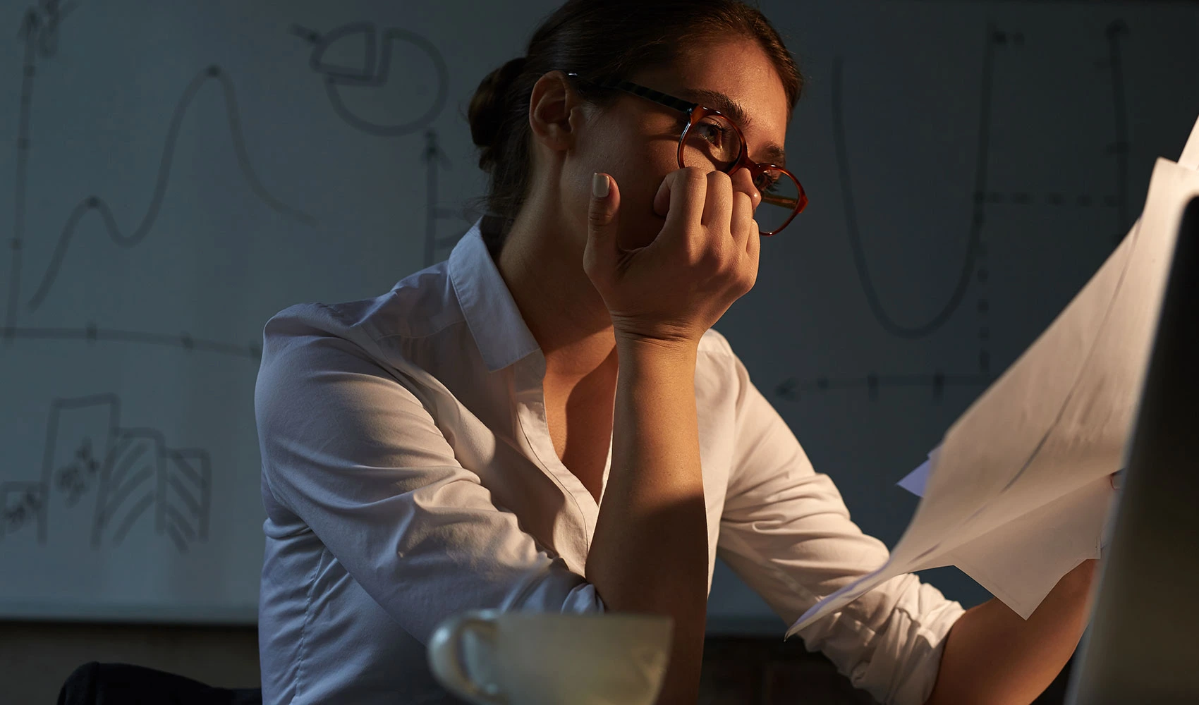 Serious woman doing night paper works