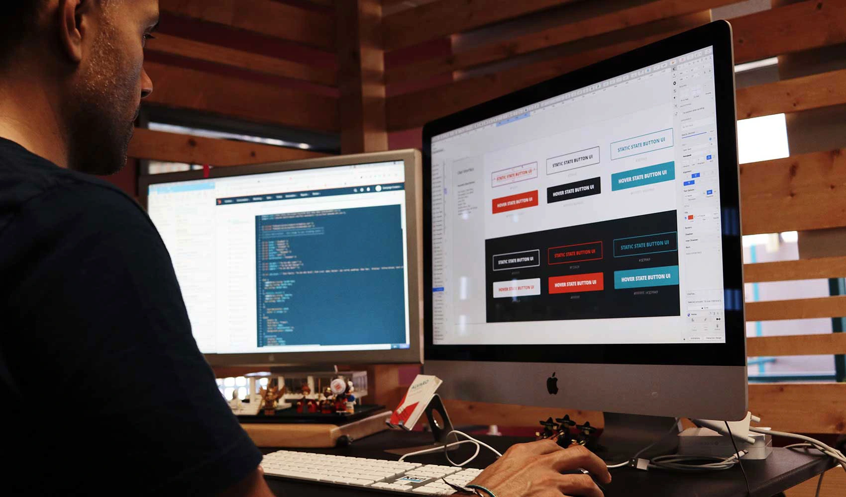 Man using a computer with dual monitor