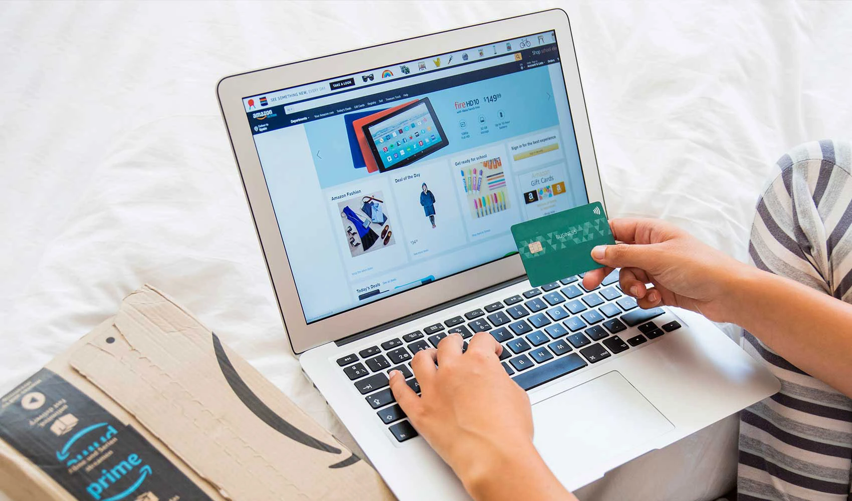 Viewing an online shopping site while holding a credit card
