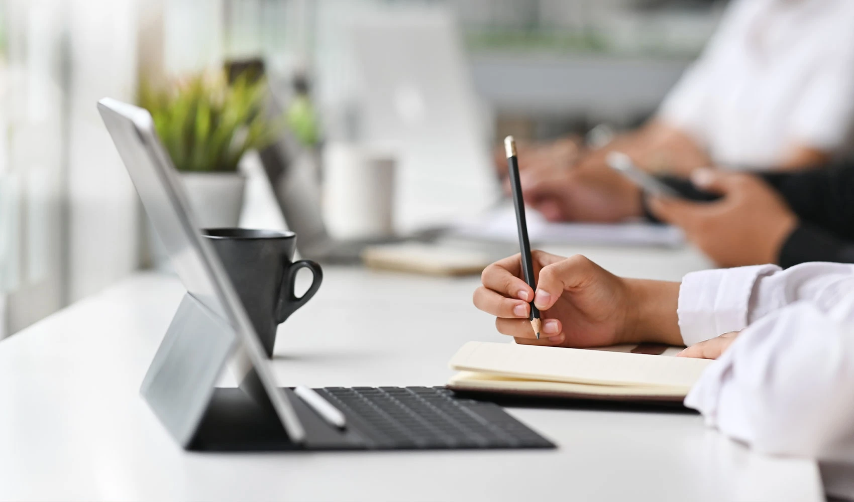 Writing idea in the notebook with digital tablet