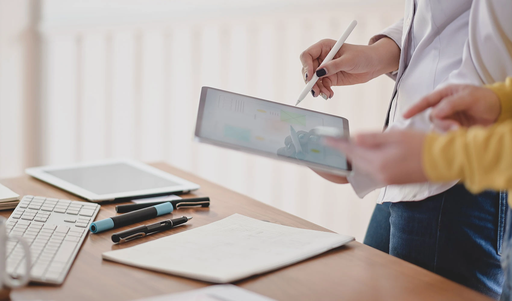 Writer working her project while using digital tablet