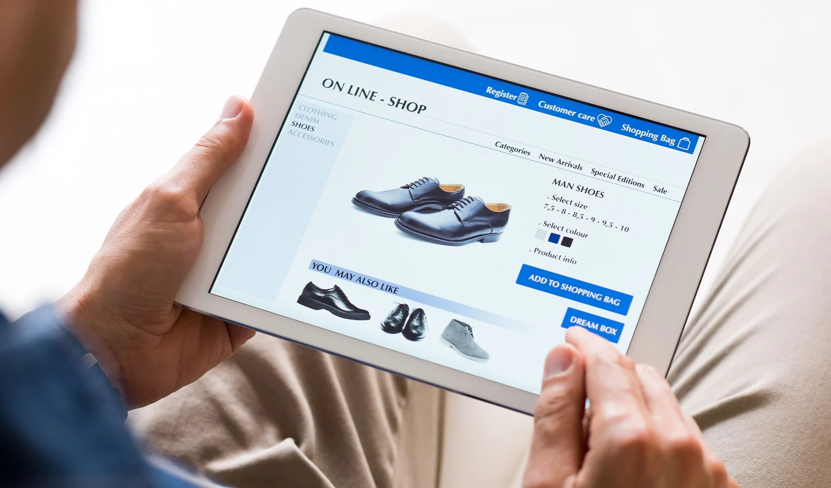 Young man looking shoes online