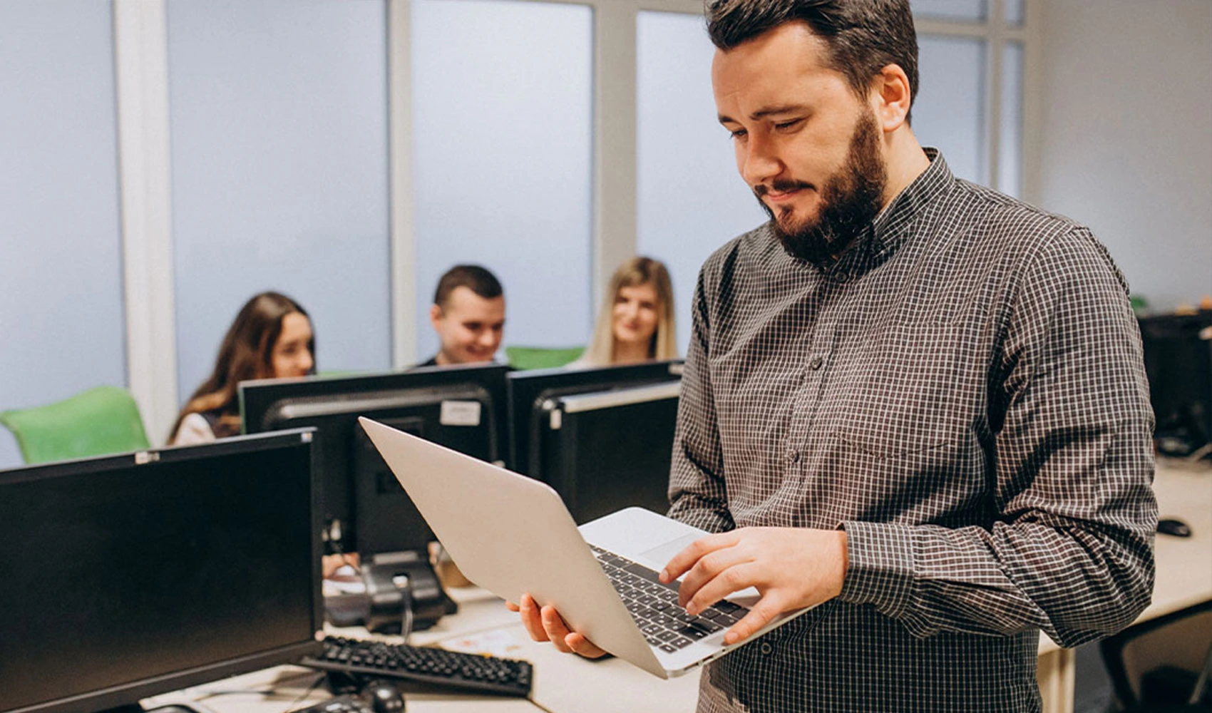 Employees working with their computers and laptop