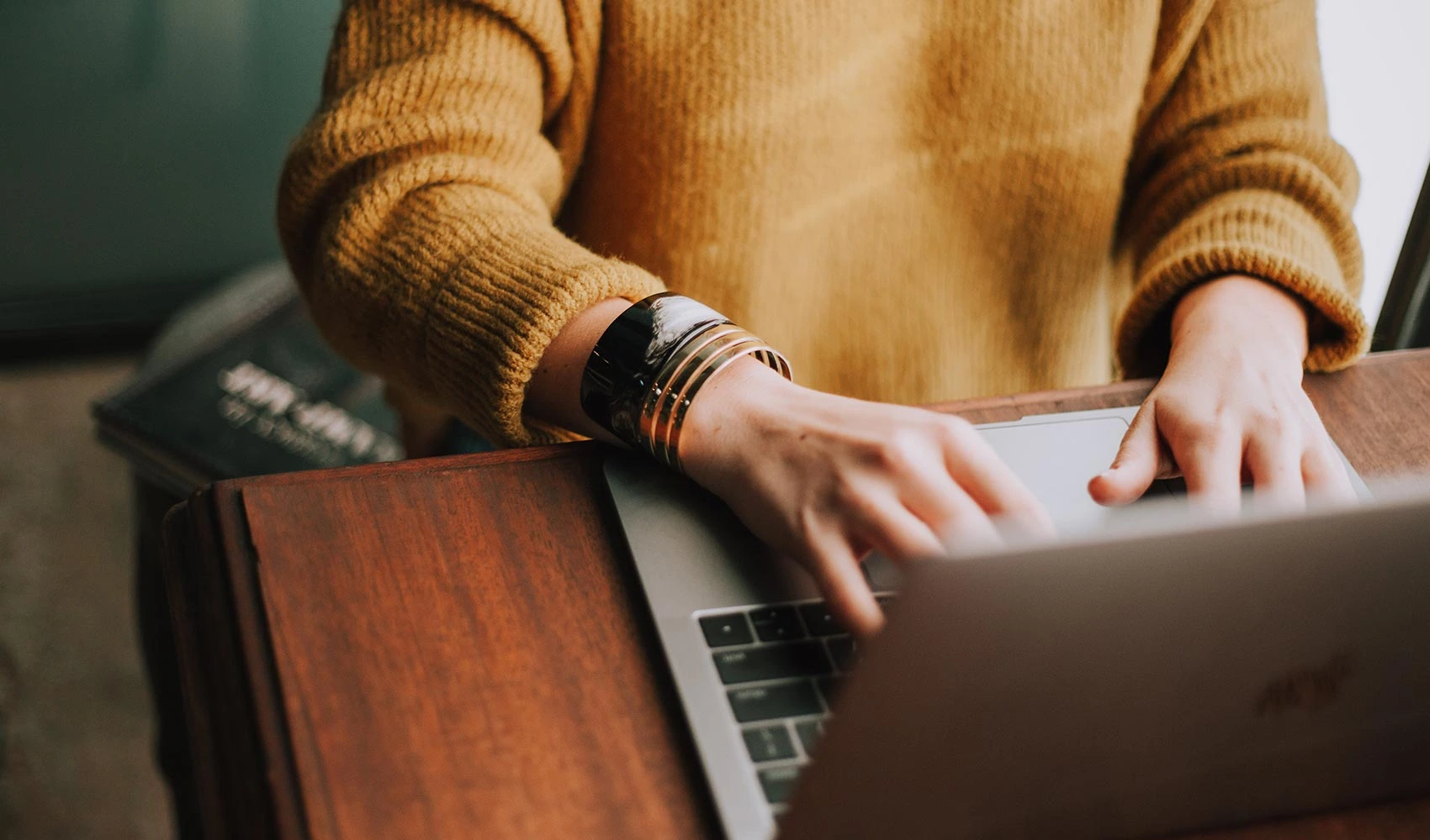 Woman typing in her laptop