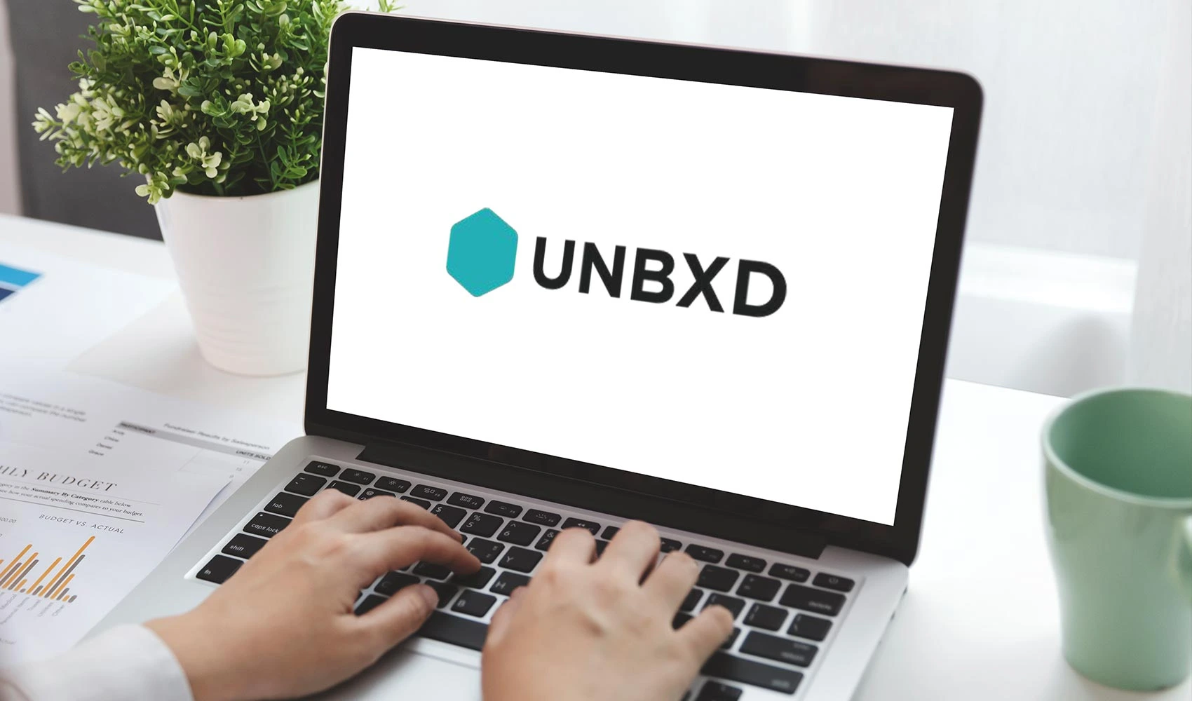 UNBXD logo in laptop screen