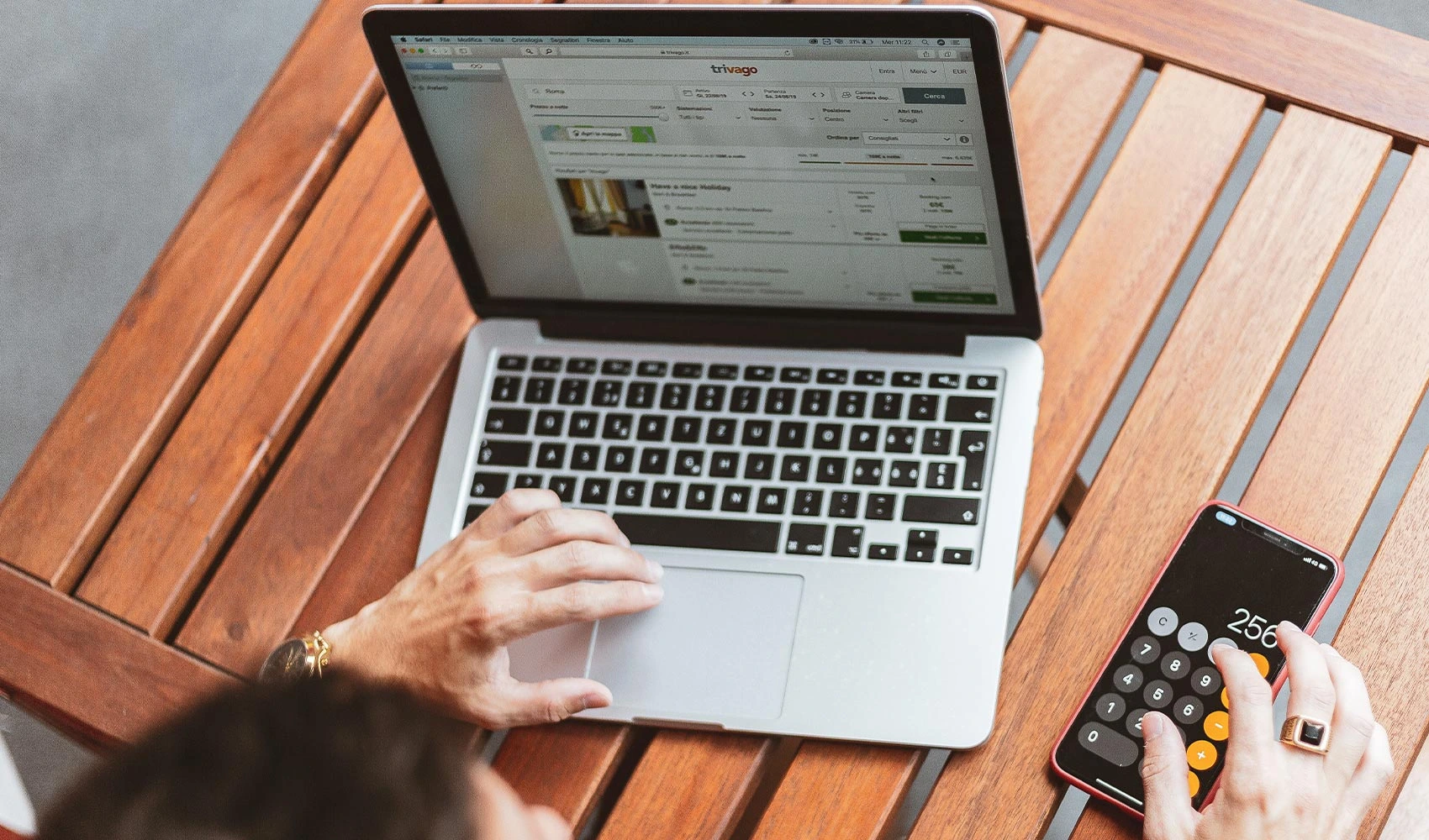 Man using MacBook and iPhone