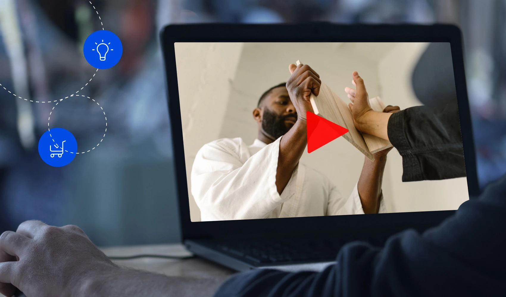 Laptop screen showing photo of a man using his hand to chop a flat wood