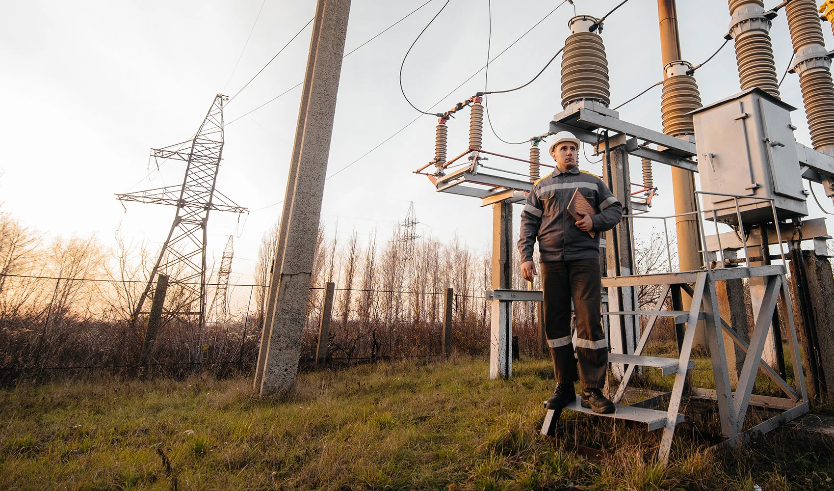 The energy engineer inspects the equipment of the substation