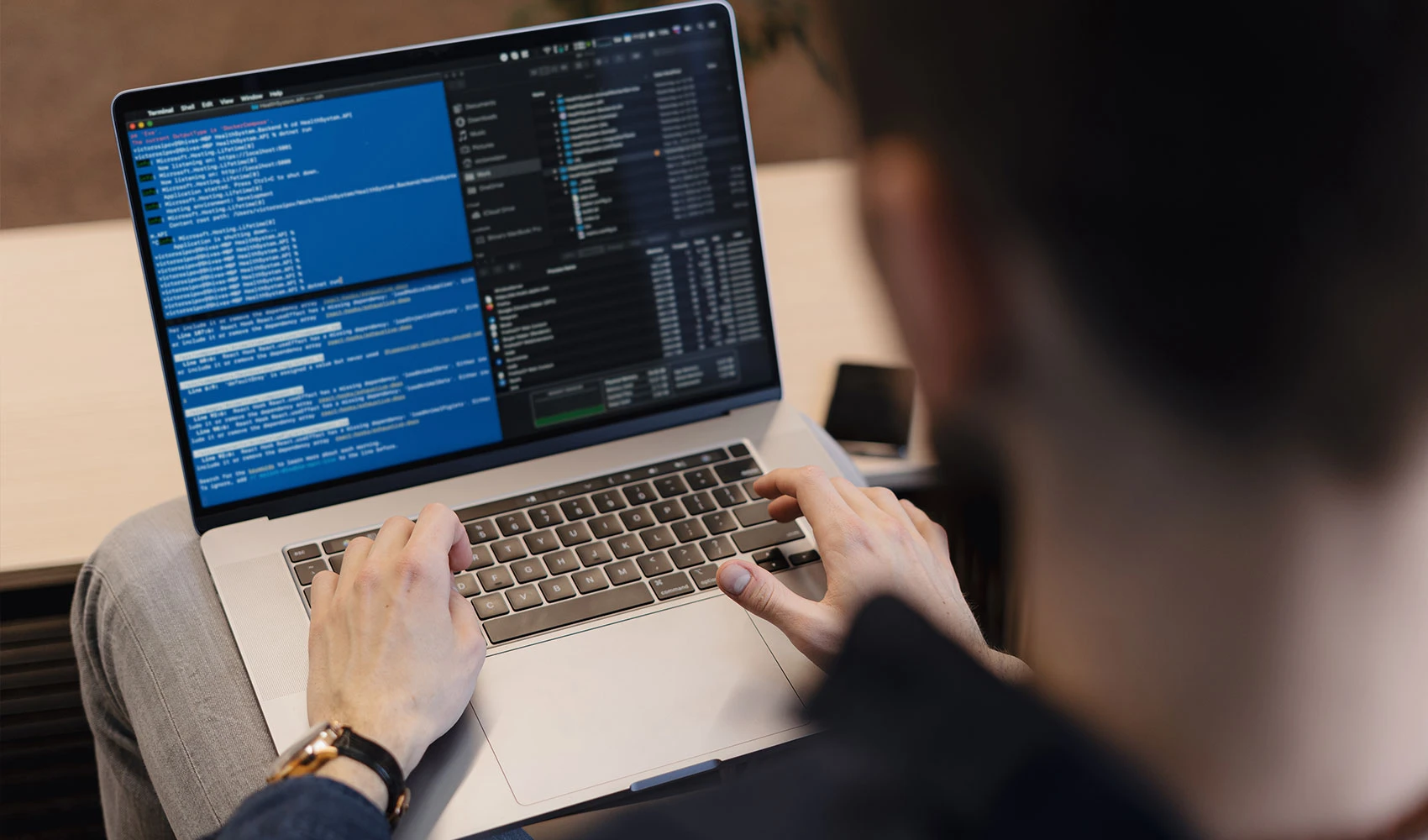 Close up man writing code on the laptop