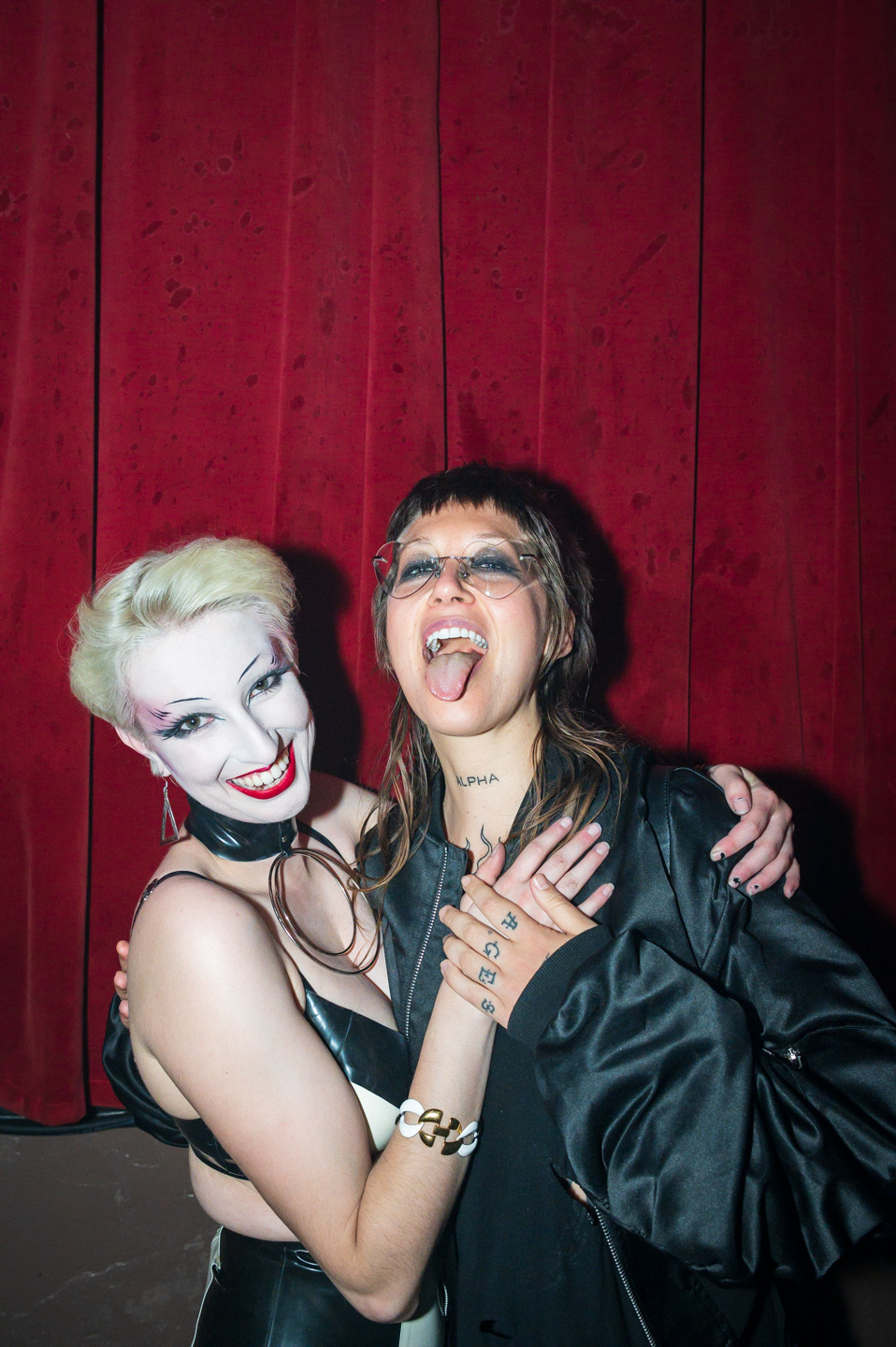 two guests celebrate at a dance party in downtown Portland, Oregon
