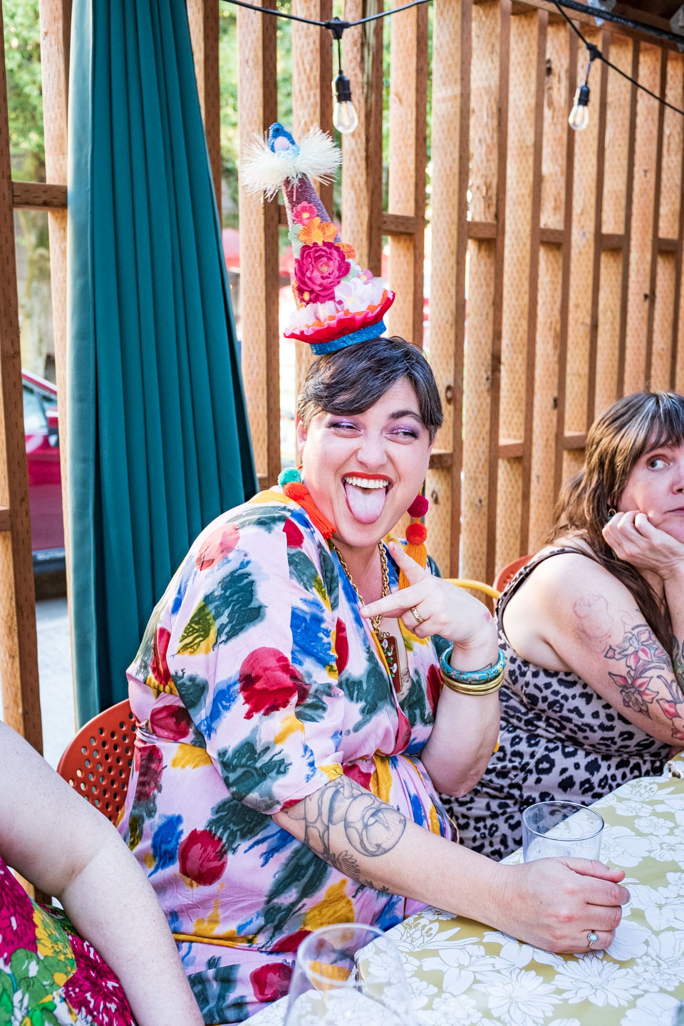 the host of a birthday party poses joyfully