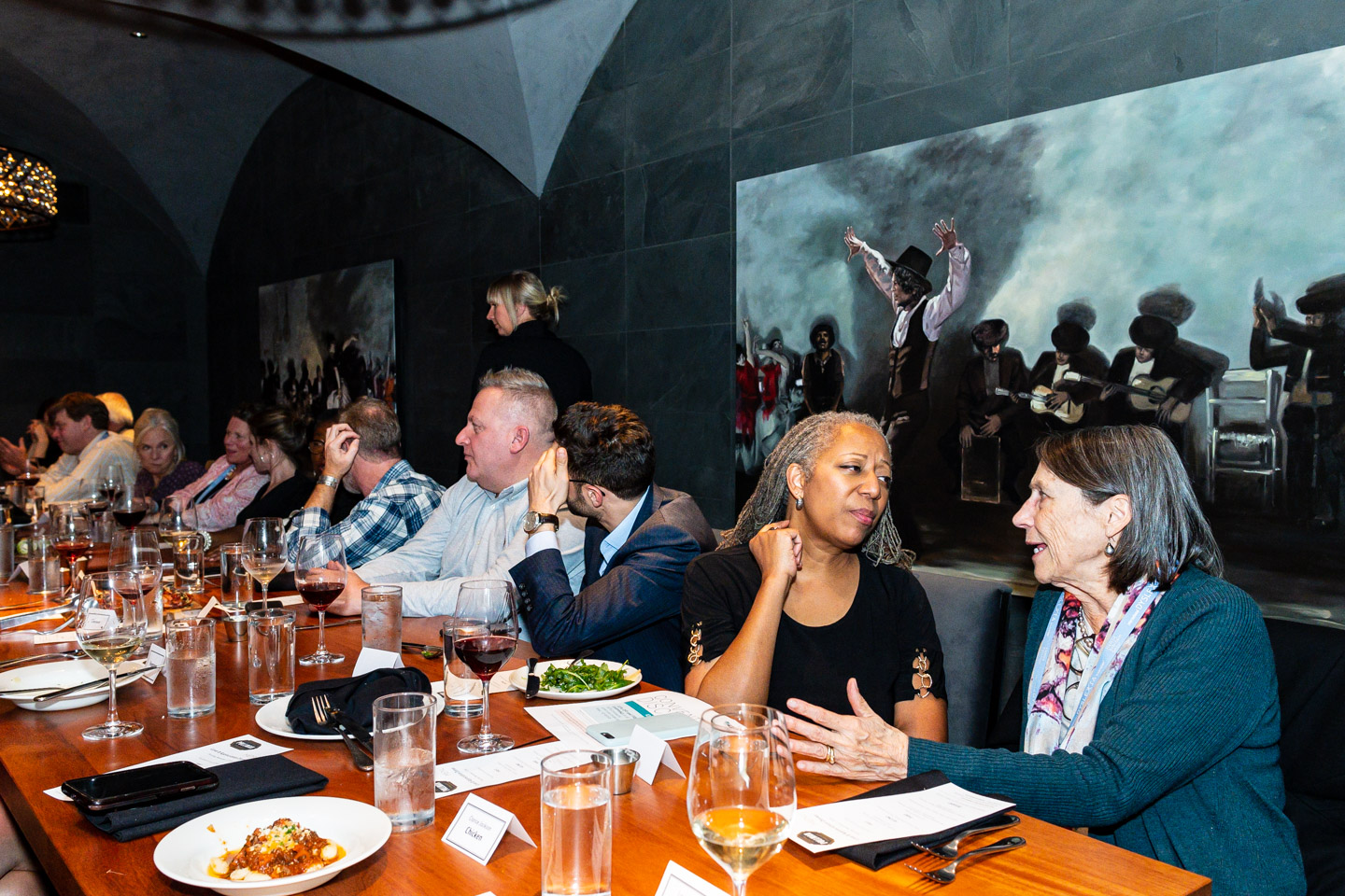 guests talk at a dinner party event in NE Portland, Oregon