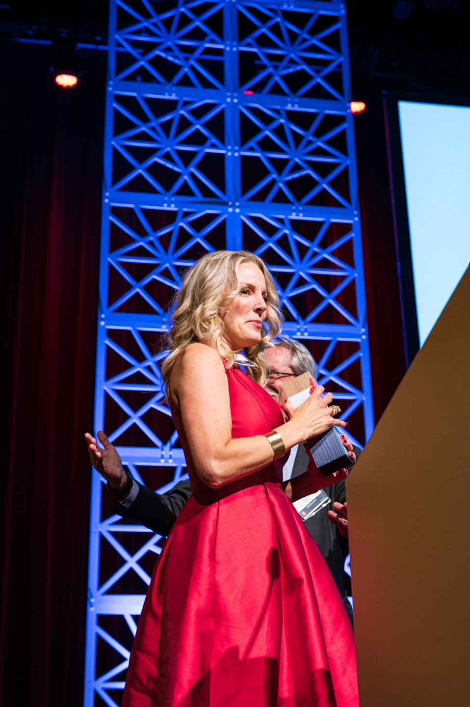 a winner walks on stage at the 2022 OEN Awards