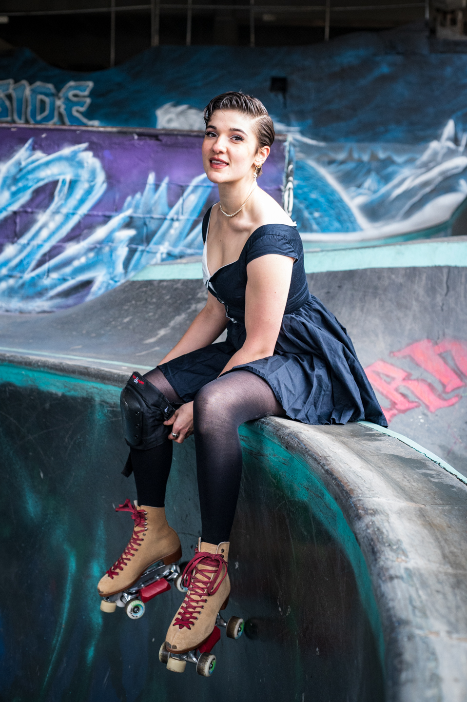 skater rests on the lip of a bowl