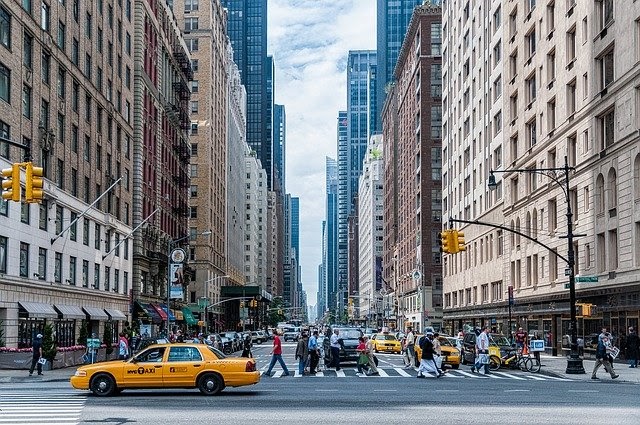 A picture of a busy street in New York City with many different people, for whom one generic email blast would not be effective