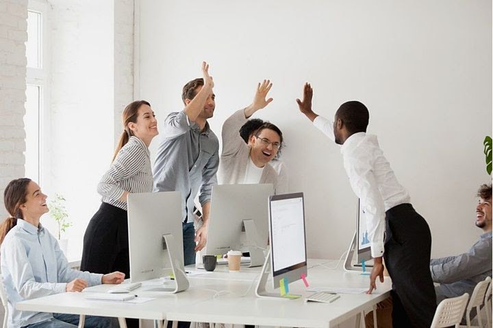 a team celebrates success