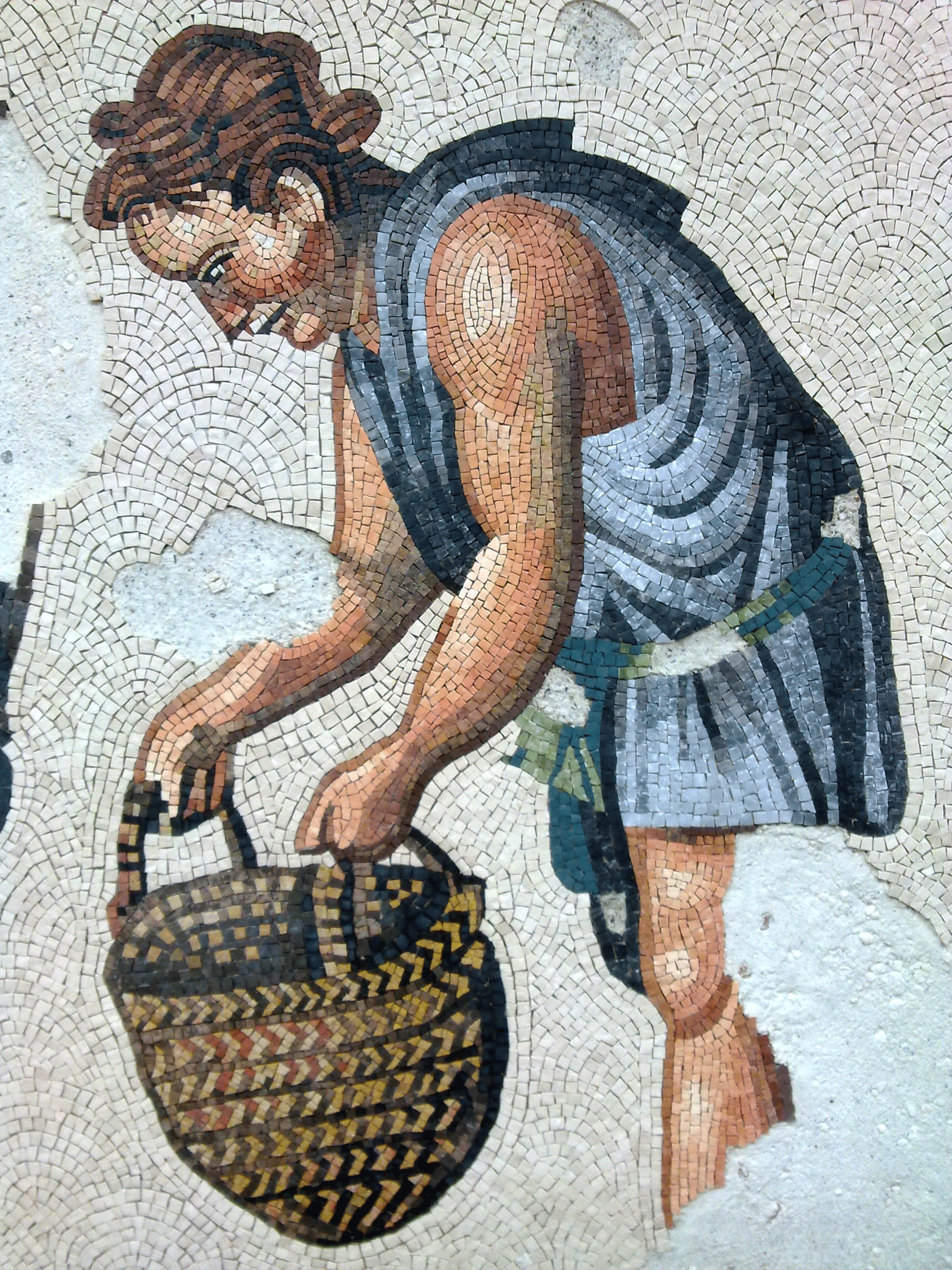 roman mosaic handmade in marble represting young man working