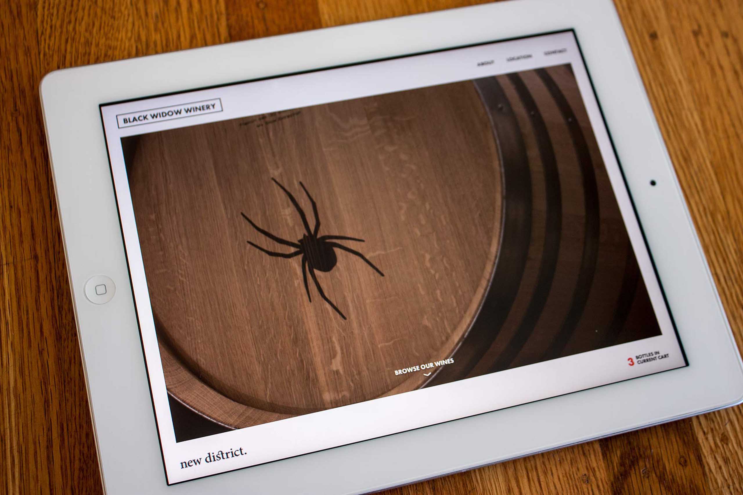 Product page for Black Widow Winery with framed image of the wine barrel with a spider logo burned into it — by Yagnyuk.