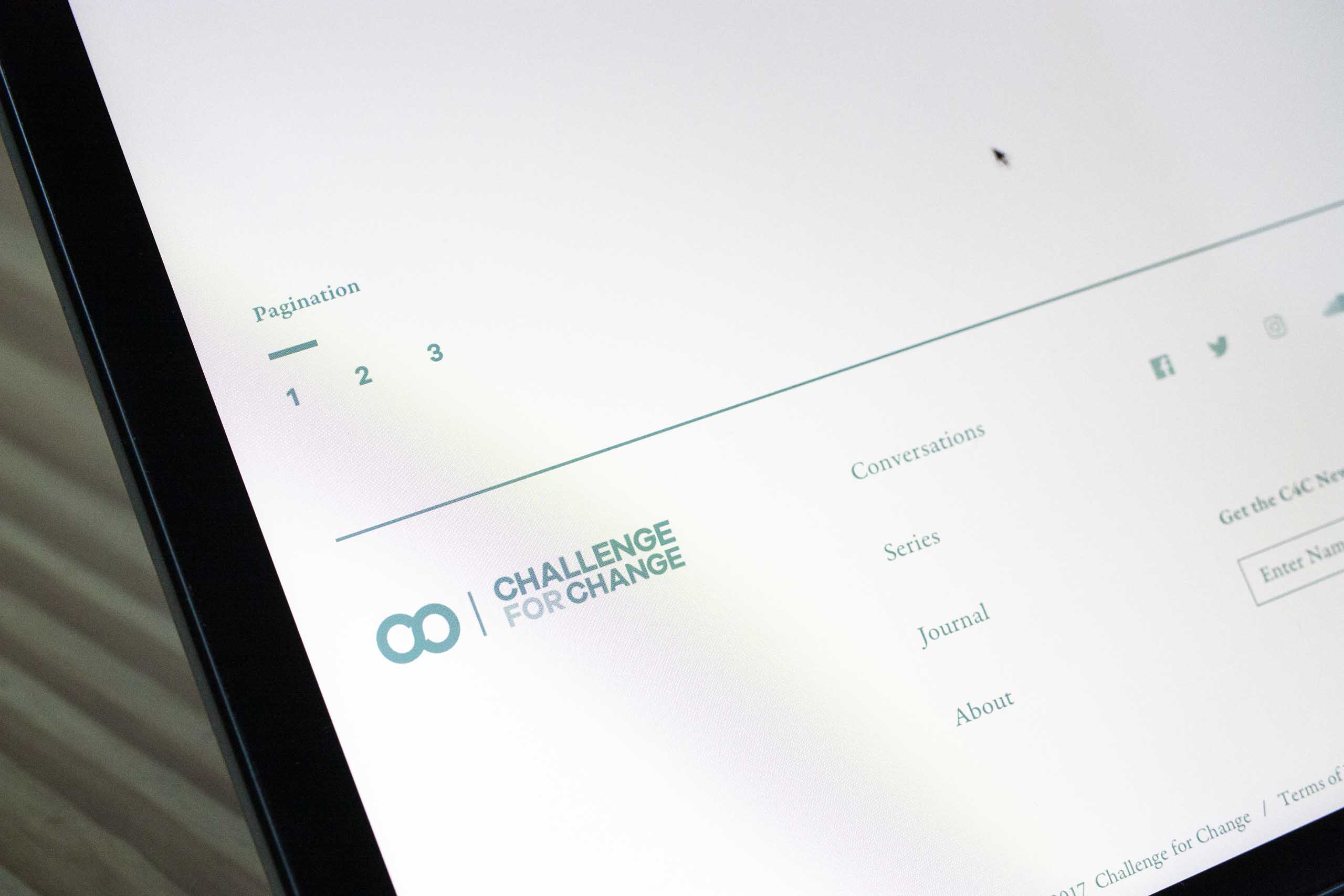 Photograph of the pagination module set in Galano Grotesque typeface above a grid based footer design — by Yagnyuk.