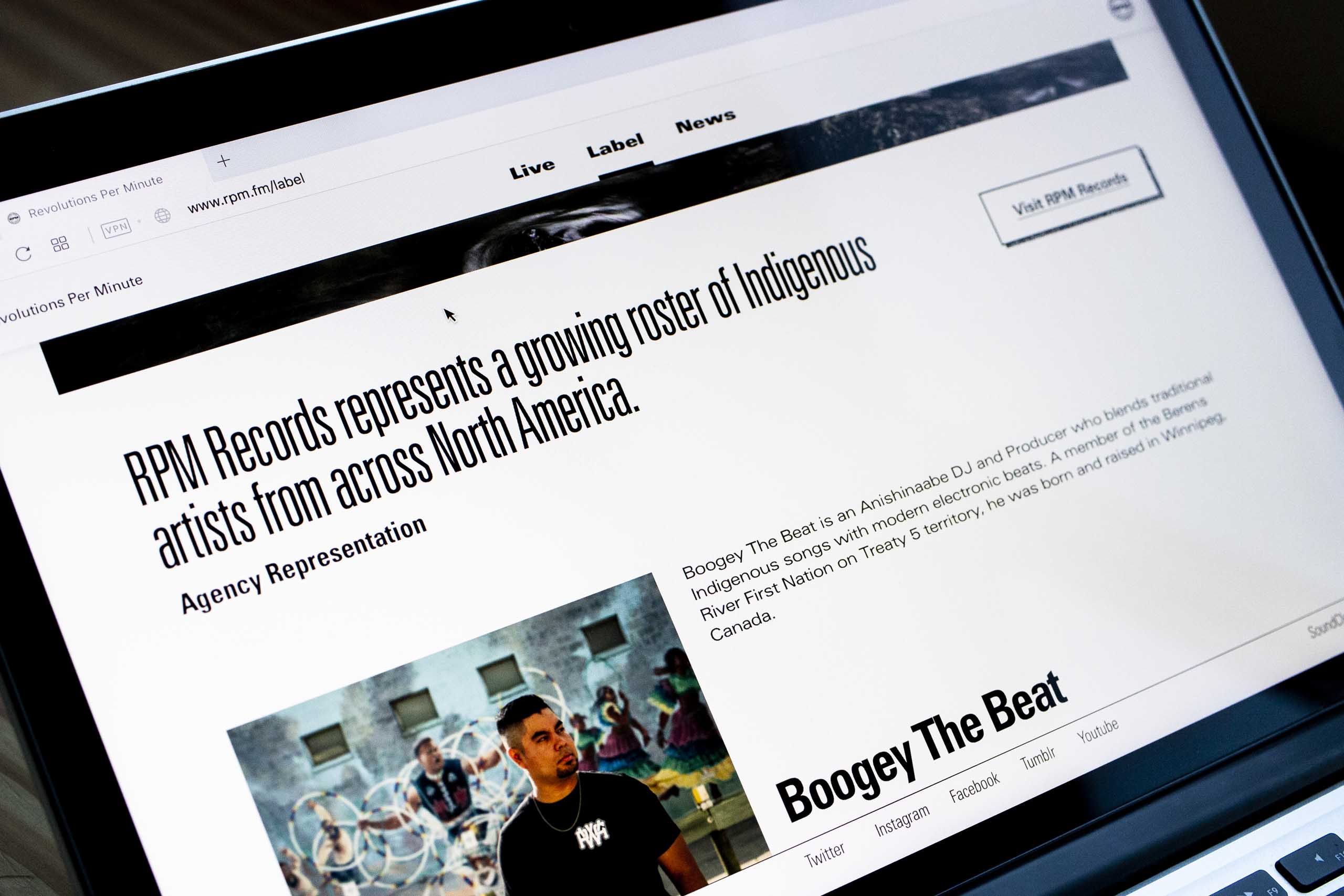 Photo of laptop with label page artist section — Yagnyuk.