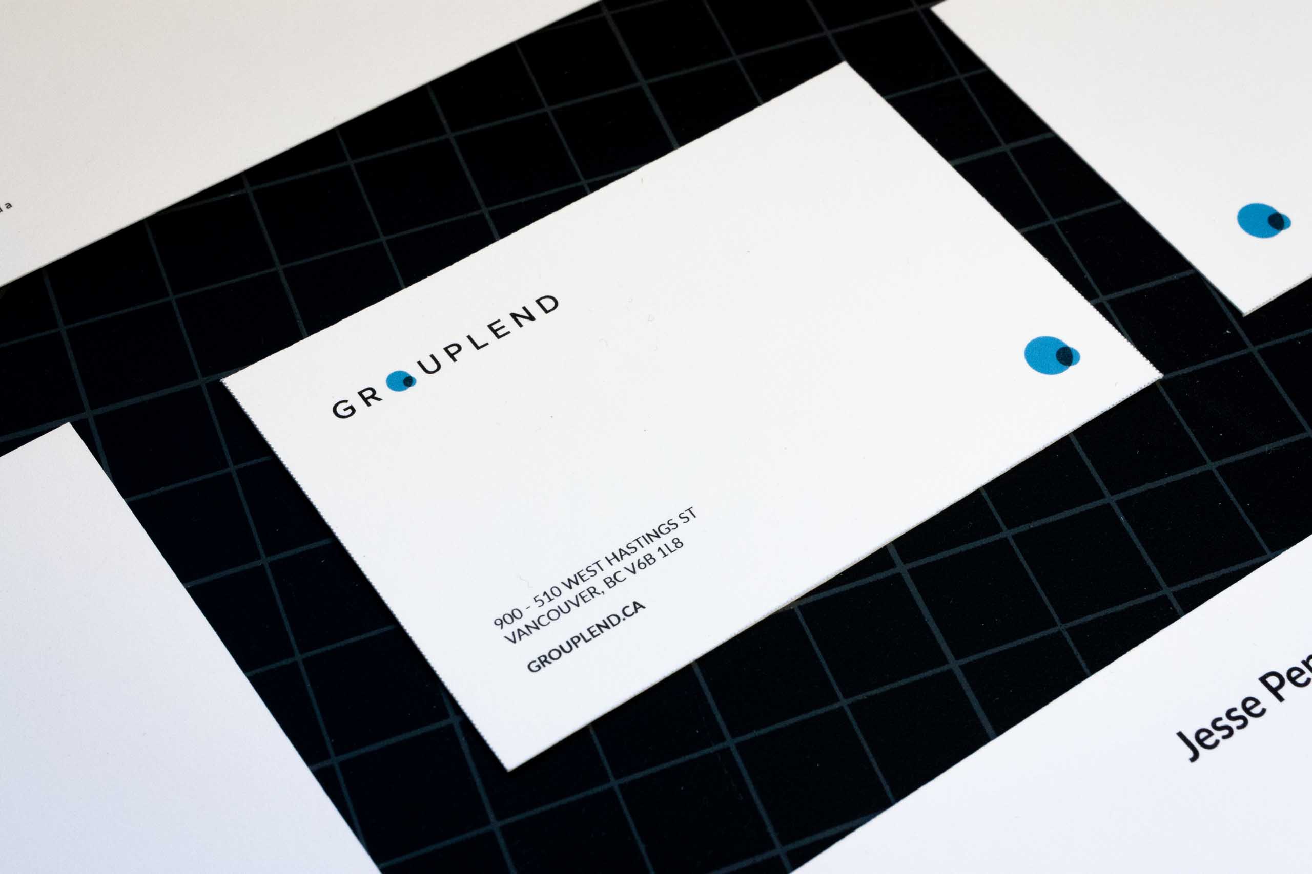 Close up of the Grouplend Business card informational side featuring company address, website and logo — by Yagnyuk.