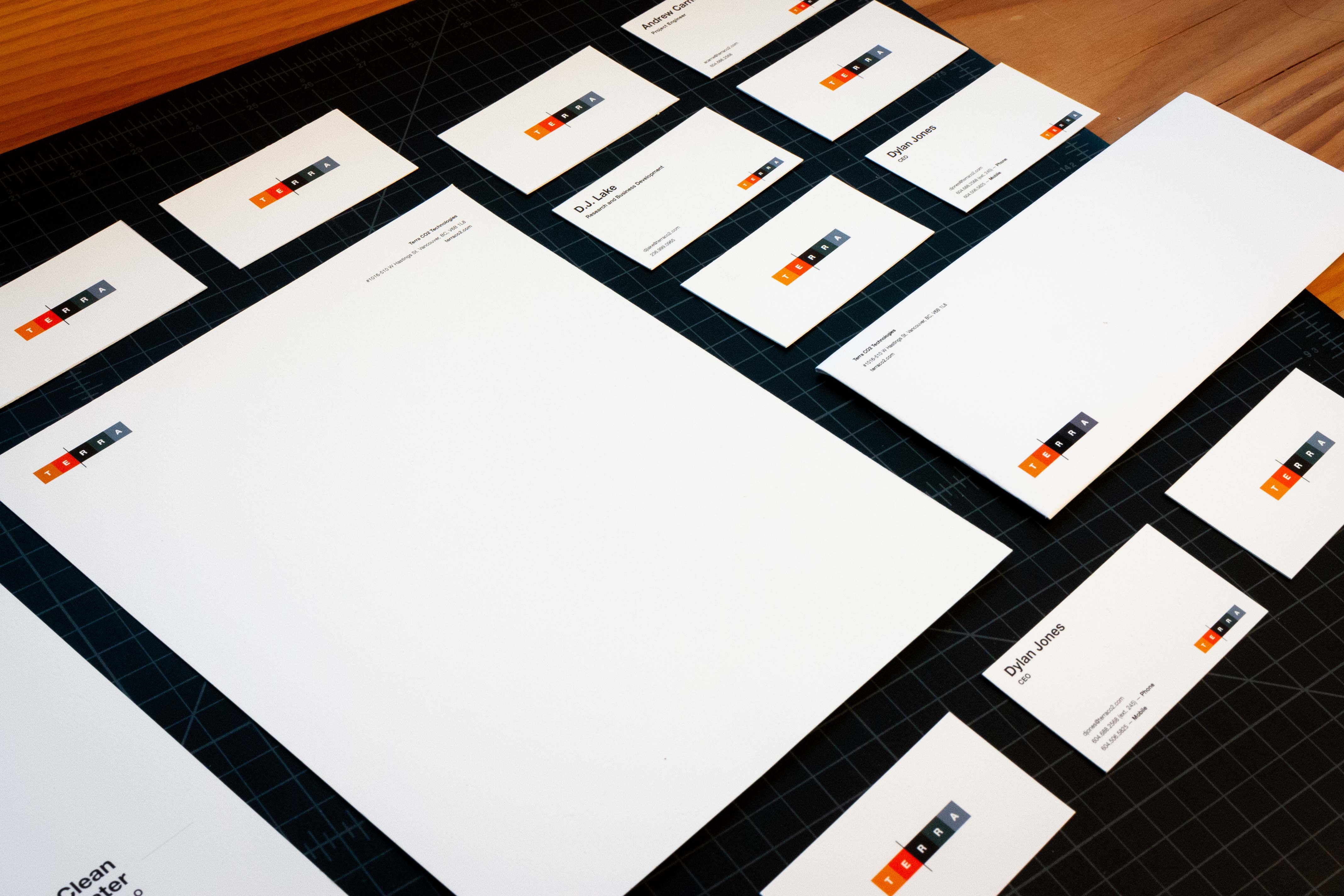 Terra CO2 set of business cards, letterhead, and envelope showcasing the vibrant colored Terra CO2 logo — by Dima Yagnyuk.