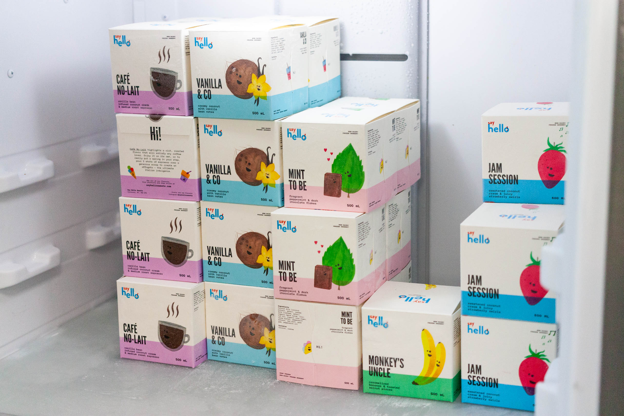 Stack of Say Hello Ice Cream cubes inside a freezer — by Yagnyuk.