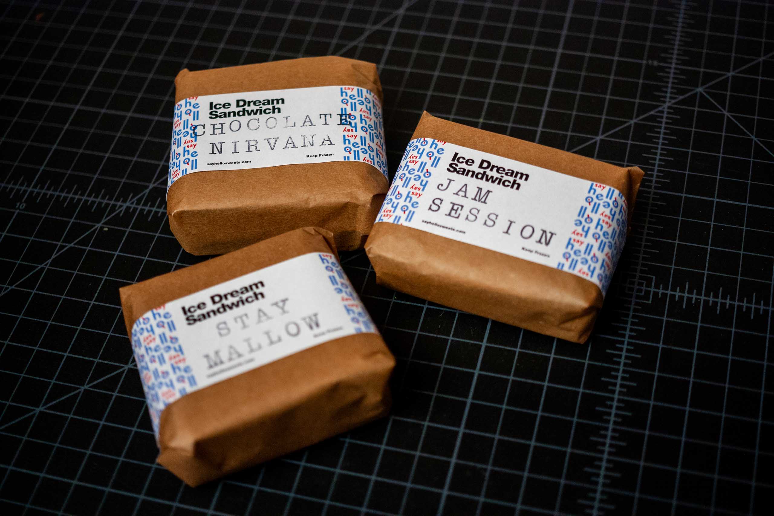 Three ice cream sandwiches lying flat — by Yagnyuk.