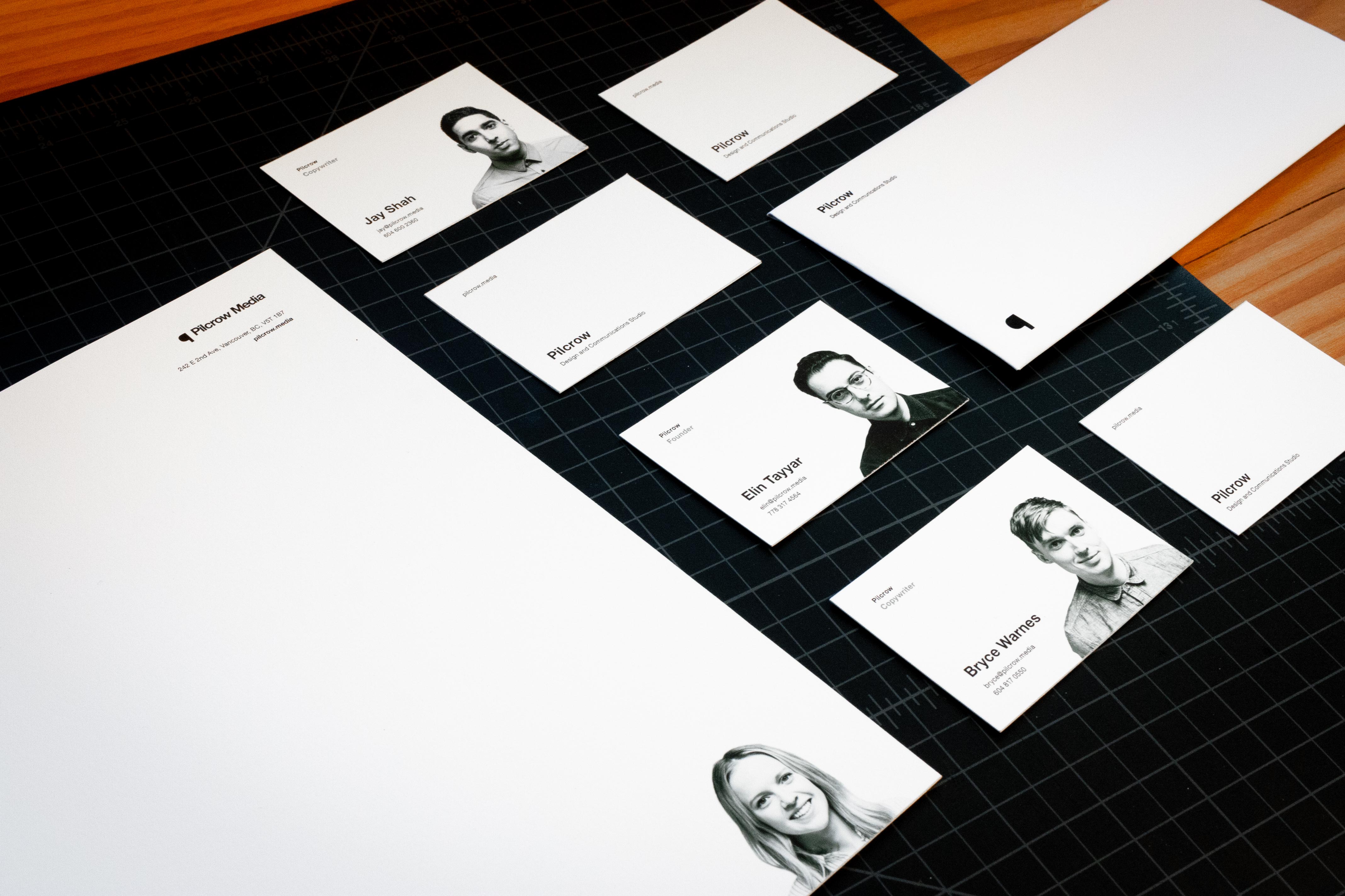Pilcrow Media envelopes and various personalized letterheads and business cards for each team member featuring their portrait photography — by Yagnyuk.