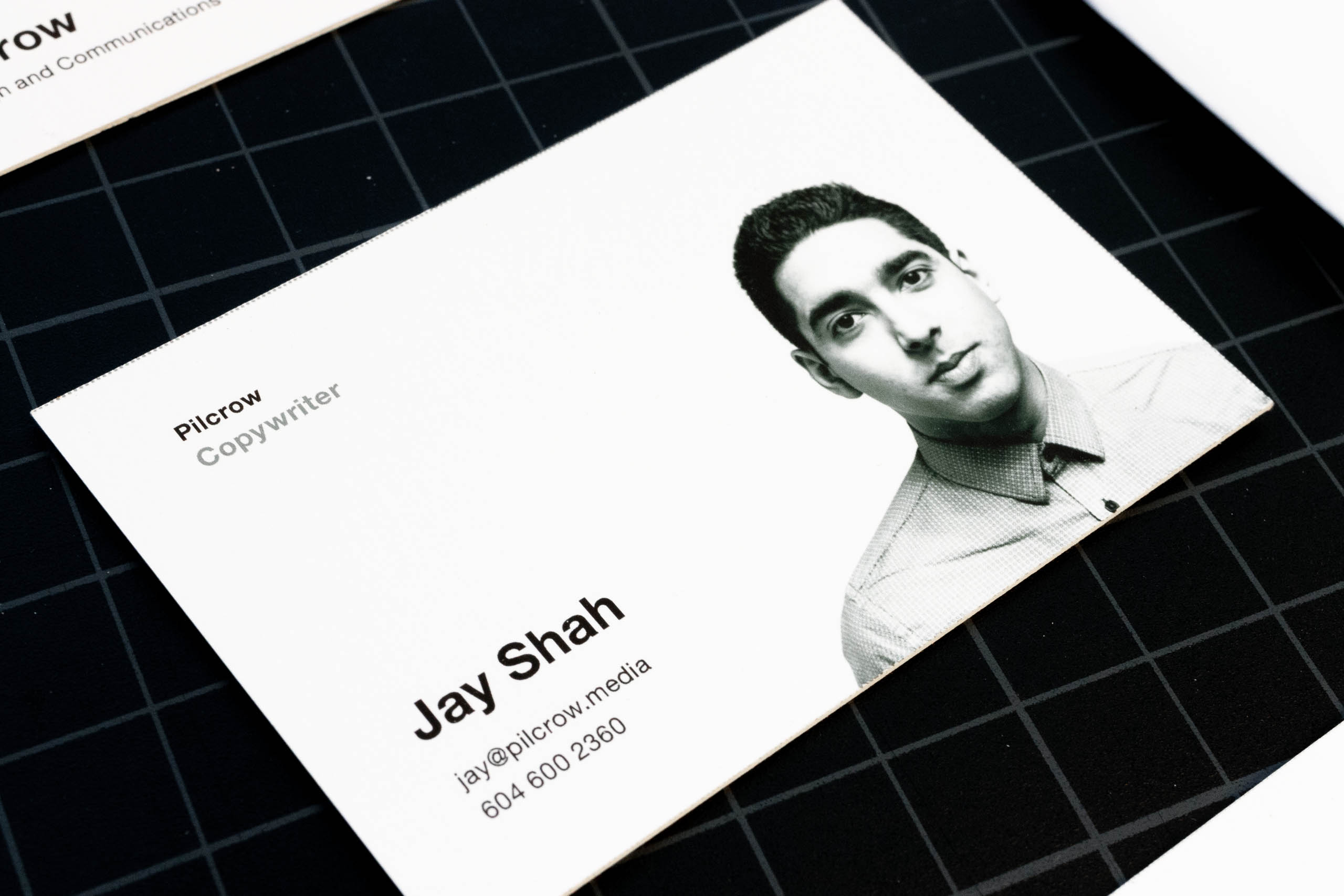 Close up of the content side of Pilcrow Media copywriter business card featuring black and white portrait photography — by Yagnyuk.