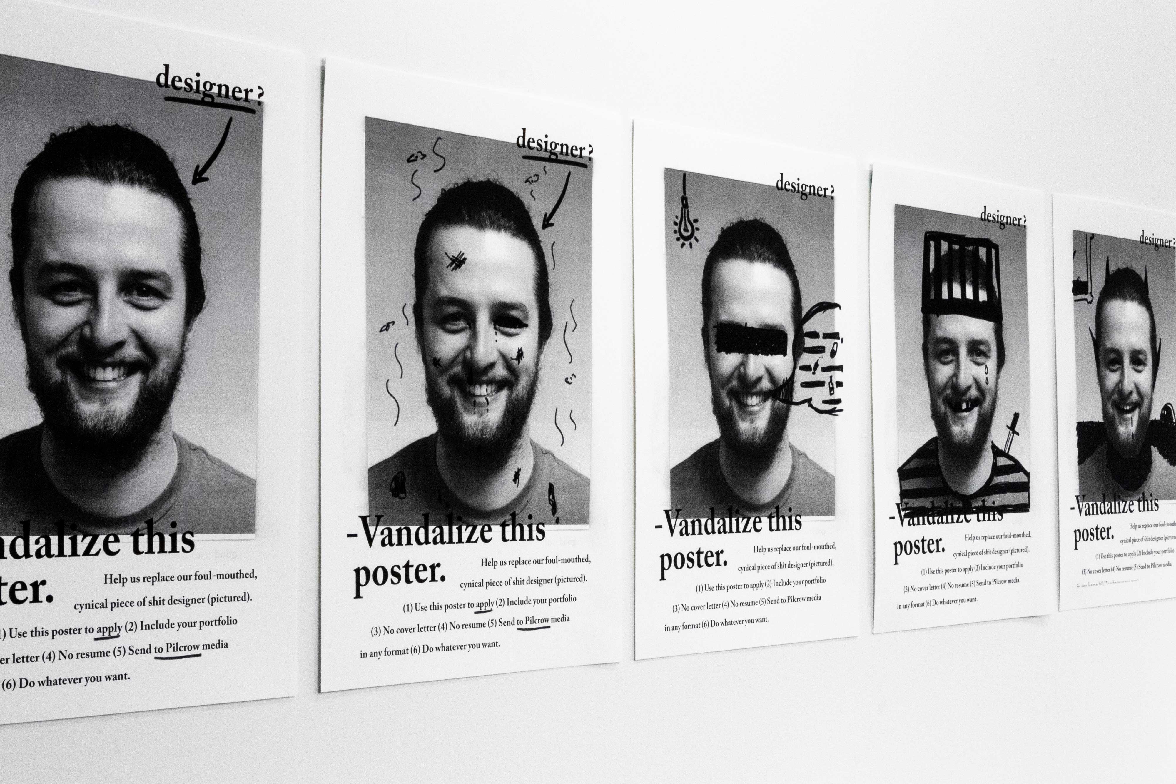 Series of posters on the wall featuring progressively more vandalized photos — by Yagnyuk.