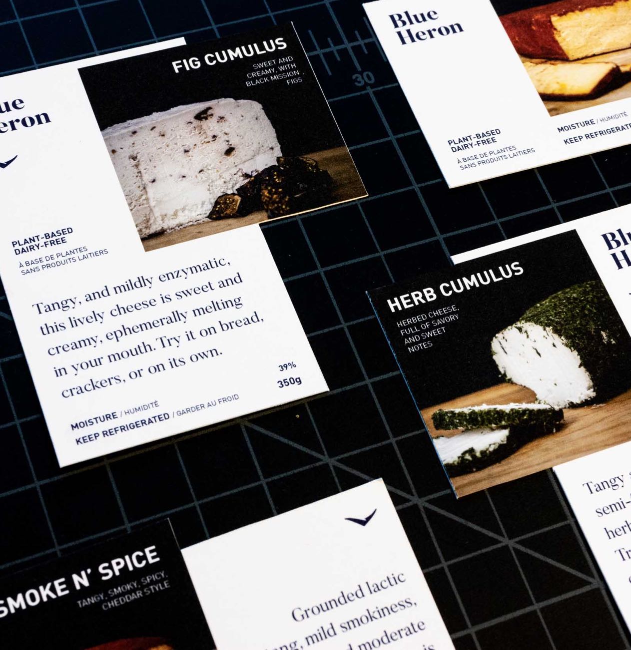 Blue Heron Cheese Labels closeup showing typography details, cheese photography, and flavour write-ups — by Yagnyuk.