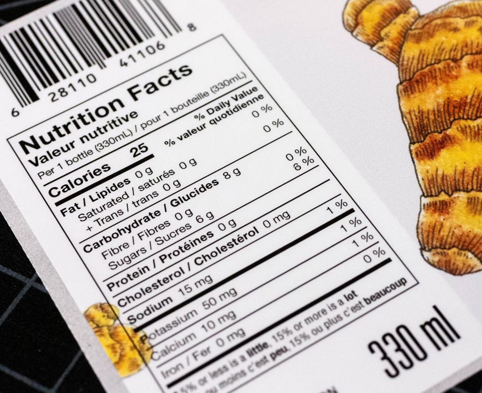 Close up details of Biota Fermentation Ginger Kombucha Nutritional Facts table showing close up details of the nutrition information and the embedded illustration by Jessica Fraser — Dima Yagnyuk.