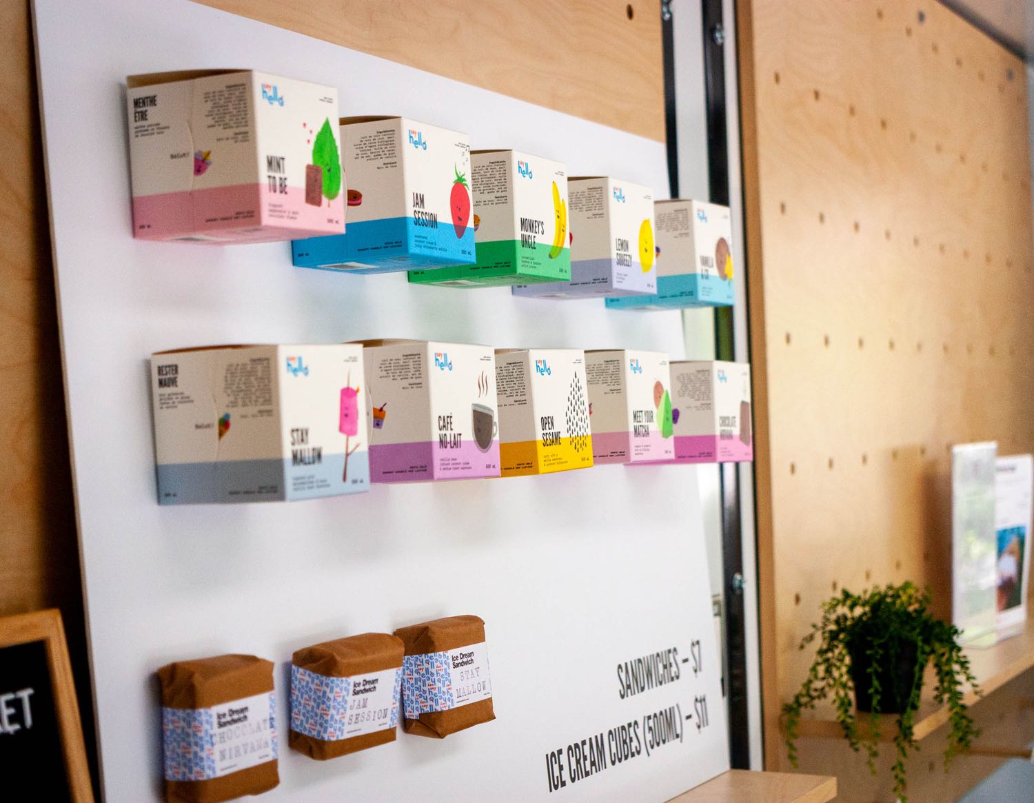 Say Hello Store Menu with physical cubes and sandwiches attached as display — by Dima Yagnyuk.