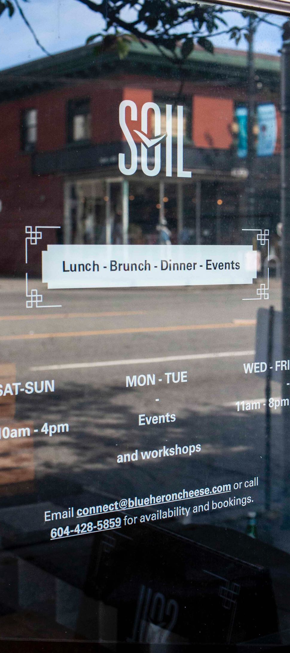 Soil Restaurant Hand painted Logo and Hours on the front door — by Dima Yagnyuk.
