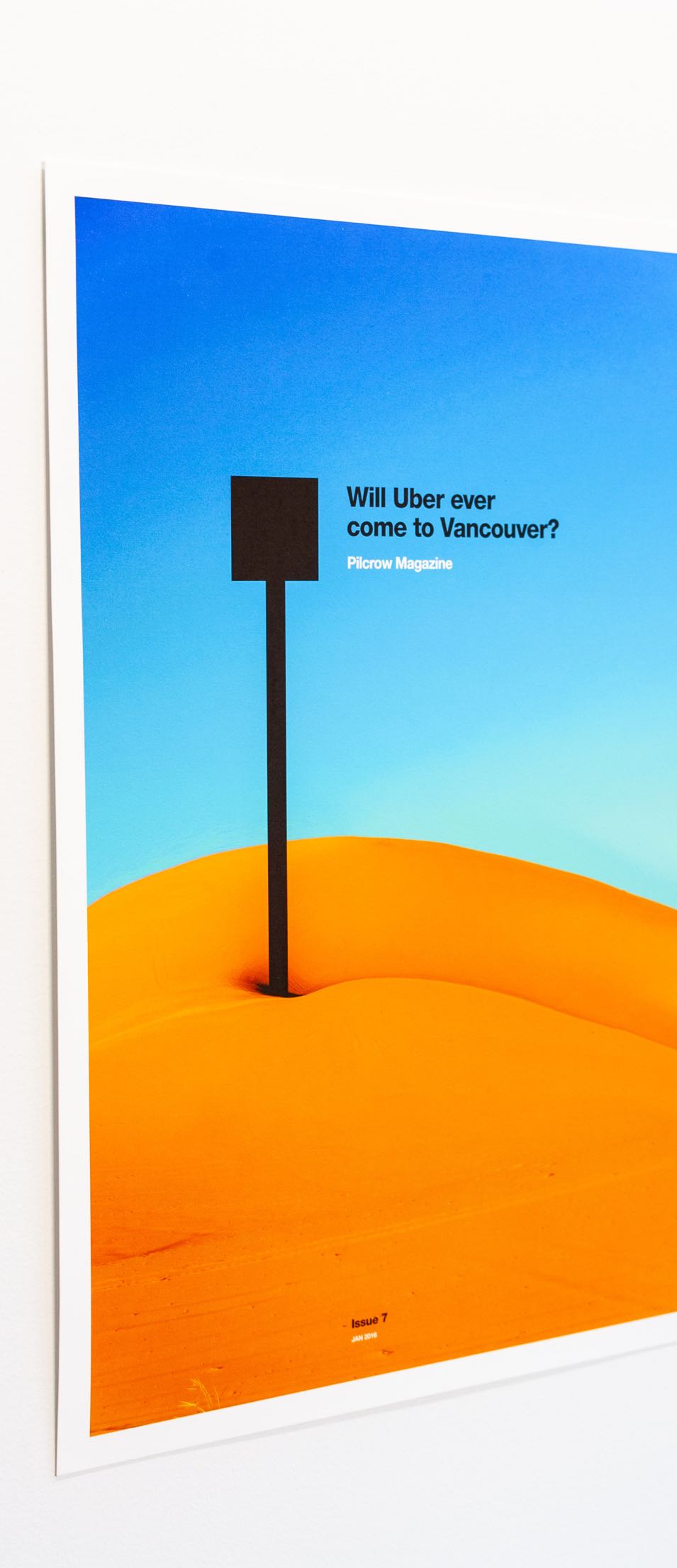 Pilcrow Magazine Advertising Poster featuring sand dunes photo distorted into a with a pin sticking in it — by Yagnyuk.