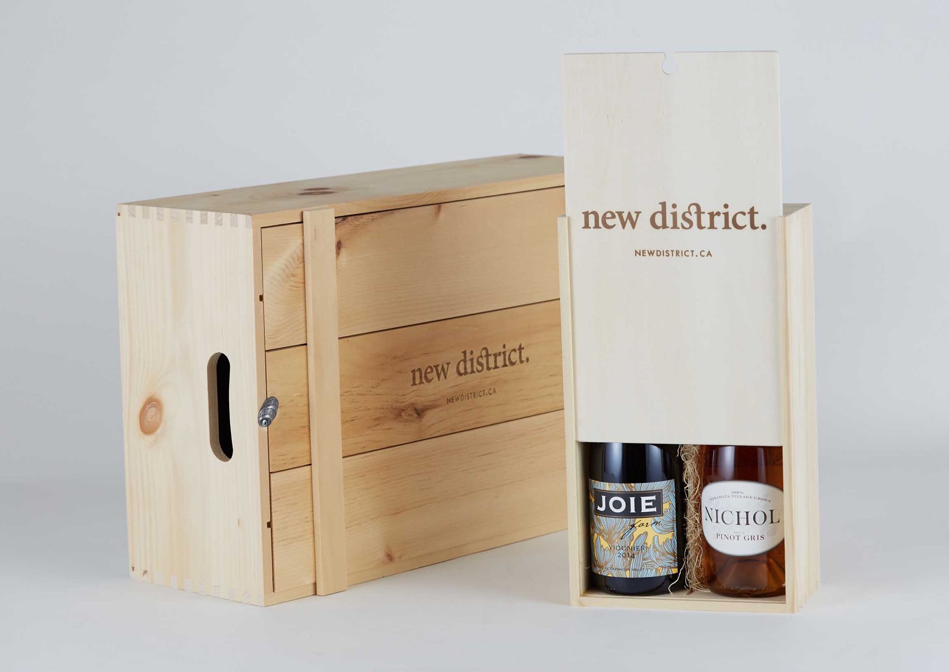 New District wooden packaging boxes for 2 and 12 bottle cases with logo burned in — by Yagnyuk.