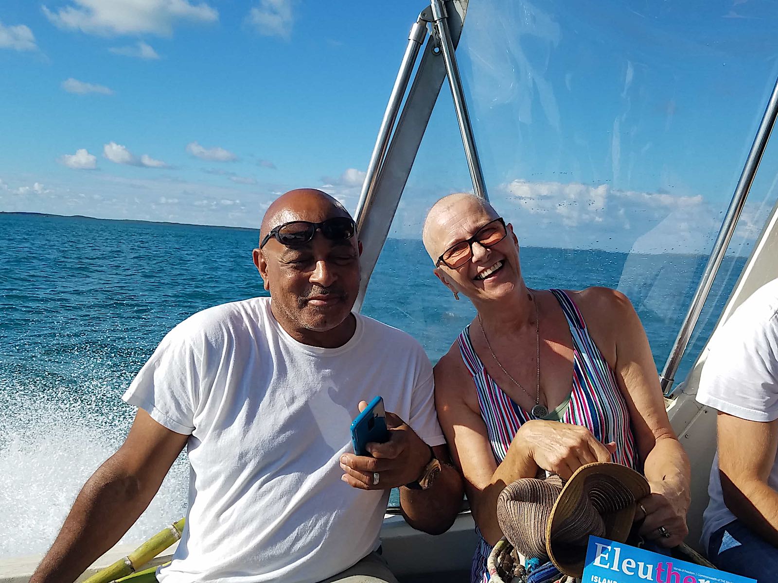 gail and a man smiling on a boat