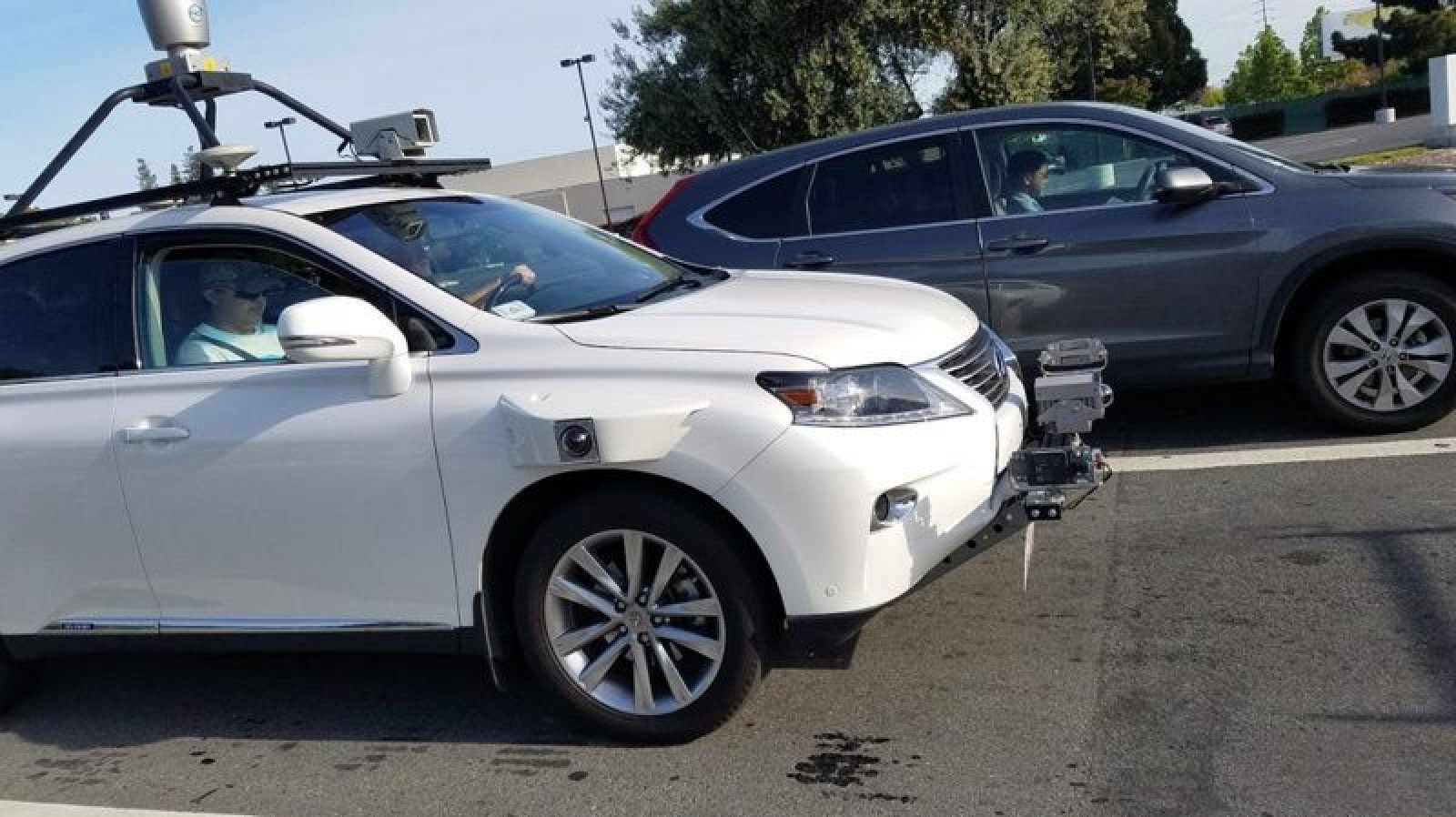self driving white Lexus SUV in San Francisco