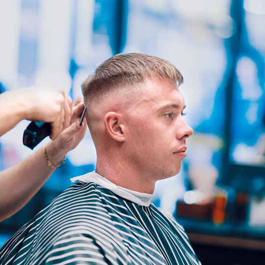 Barber Doing Skin Fade Hairstyle