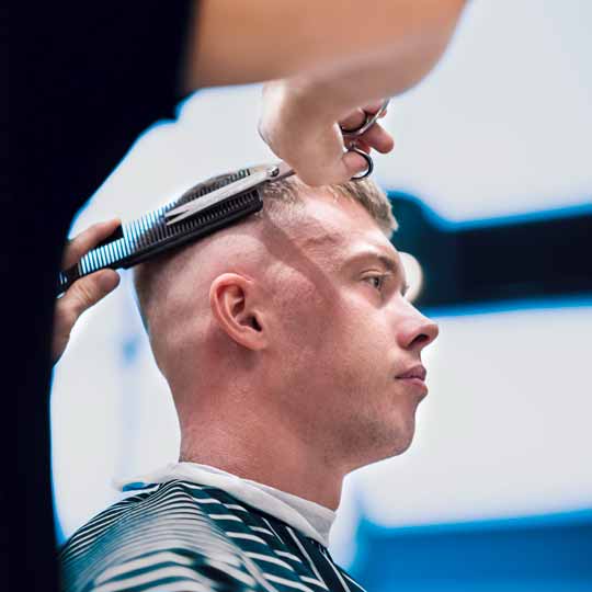 Barber Doing Skin Fade Hairstyle