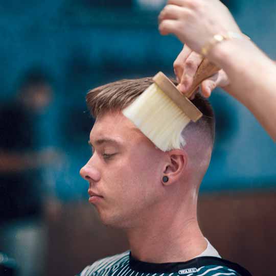 Barber Doing Skin Fade Hairstyle
