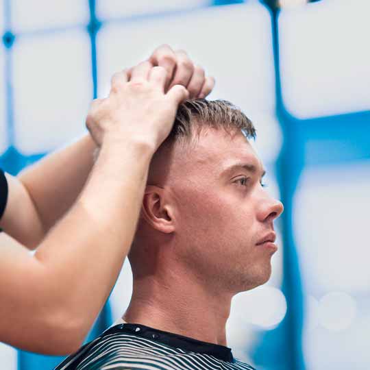 Barber Doing Skin Fade Hairstyle