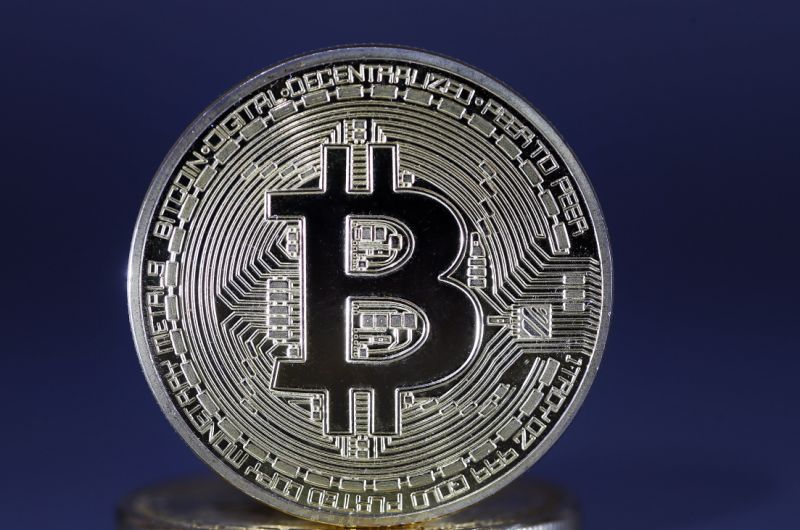 PARIS, FRANCE - APRIL 03: In this photo illustration, a visual representation of the digital Cryptocurrency, Bitcoin is displayed on April 03, 2019 in Paris, France. Bitcoin is an electronic money that has seen an incredible increase in 2017, its price has reached 20,000 euros. But, while cryptocurrency has been trading for some months around 3200 to 3500 euros, it has risen to 5000 euros since yesterday. According to one analyst, this move would be linked to a single buyer who would have passed a colossal order to make up the course. (Photo by Chesnot/Getty Images)