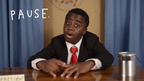 GIF of young boy sitting at a desk saying "Pause. Breathe. Love."