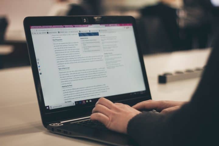 Woman typing on laptop