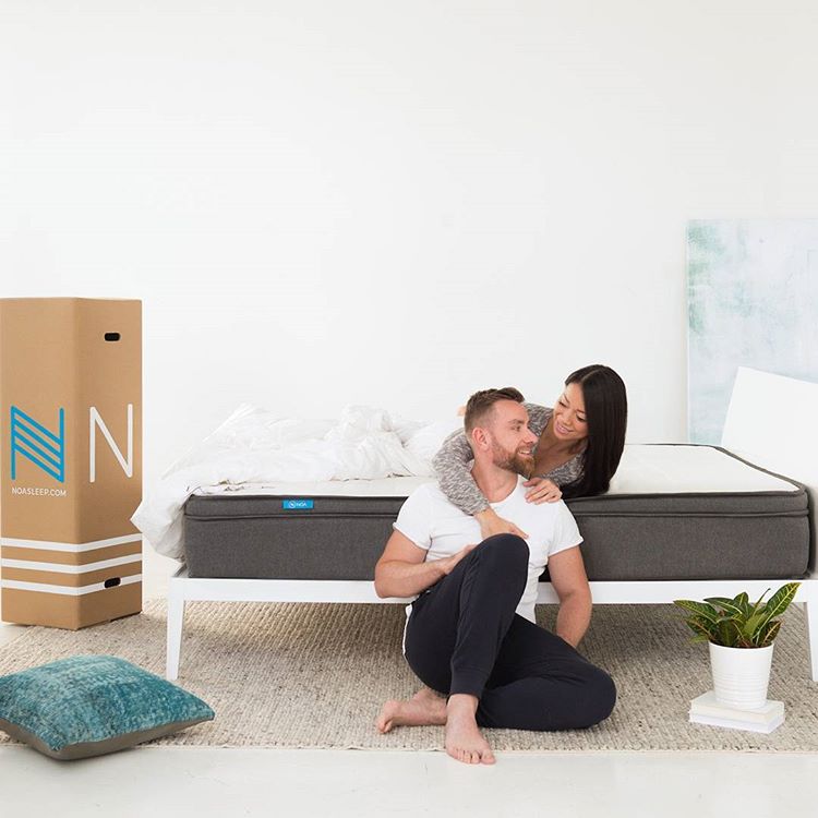Couple unpacking Noa mattress
