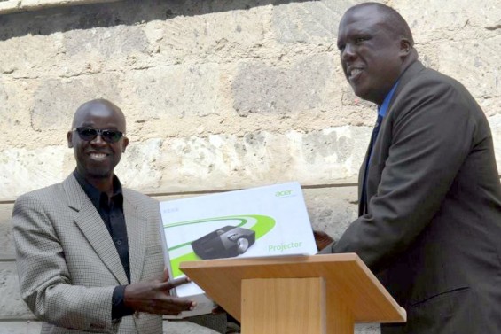 Joe presenting projector to eduKenya Executive Director, Bob Kikuyu