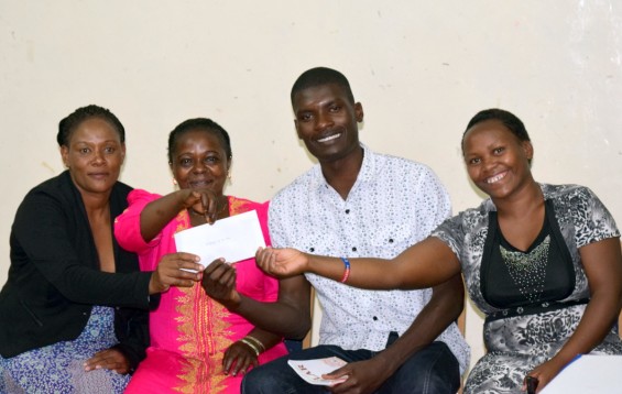 Lewin Obwora shares a moment with his adult students.